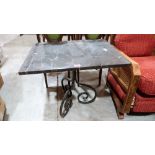 A marble topped table on wrought iron base. 27'' wide