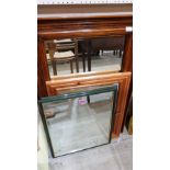 A walnut framed wall mirror with bevelled plate. 38'' high and three smaller mirrors