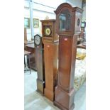 An oak cased grandmother clock and two long clock cases