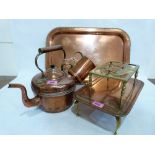 A Victorian copper kettle; a copper tray; two footmen; copper mug and jug