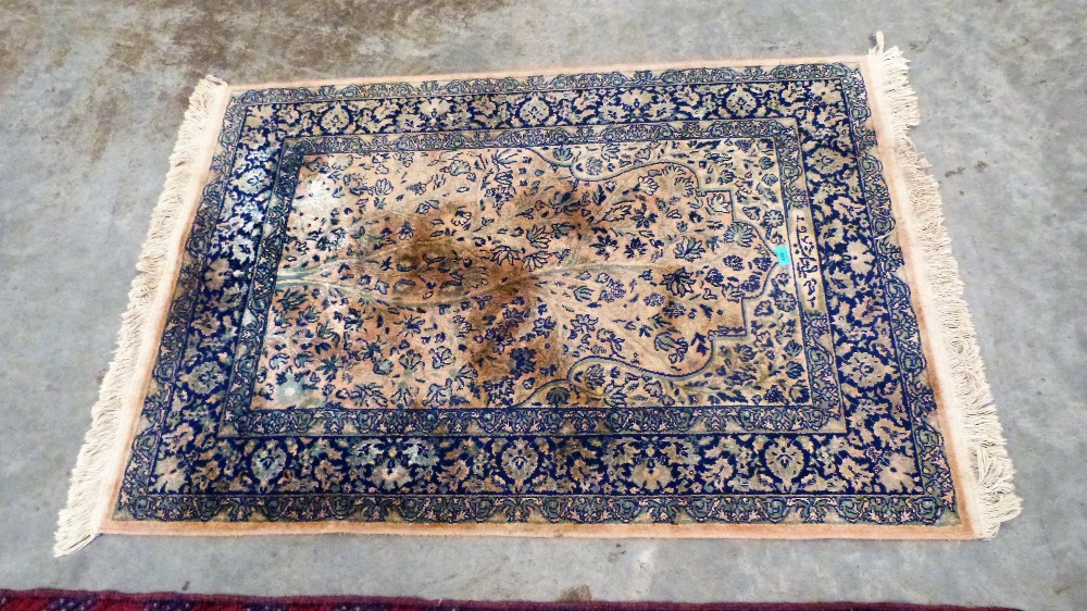 An eastern rug. 143cm x 110cm