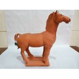 A terracotta horse figure by Owen Thorpe. Signed to the base and numbered 1395. 18'' high