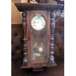 A walnut Vienna style wall clock. 30'' high