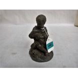 A 19th century speltar figure of a child with a rabbit