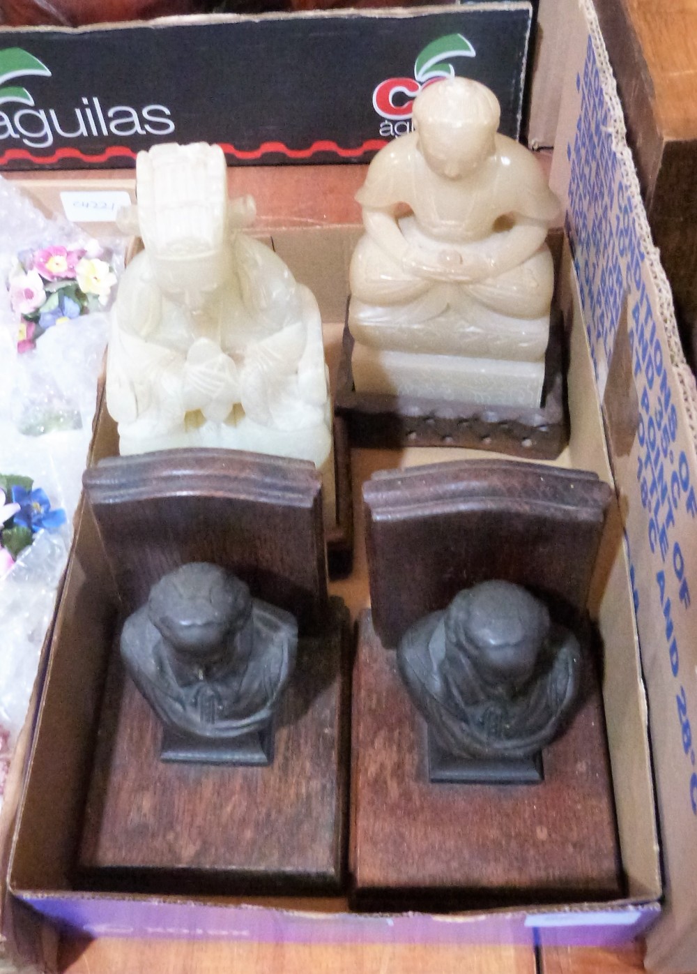 A pair of bronzed Shakespeare bust bookends and two oriental soapstone figures