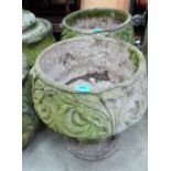 A pair of acanthus moulded planters on pedestal bases. 19'' high