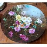 A continental ceramic charger painted in colours with wild flowers. Signed J.B David. 14½''