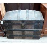 A 19th century dome top trunk with tooled leather panels and wood strapping. 36'' wide