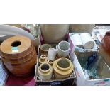 A collection of stoneware jars and old bottles