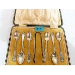 An Edward VII cased set of six silver teaspoons and sugar bow. Sheffield 1907