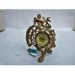 A 19th century French rococo revival gilt speltar mantle clock with drum movement (running). 8½''