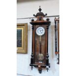 A late 19th century Vienna timepiece with single train movement and two piece enamel dial, walnut