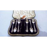 A Victorian cased set of six silver teaspoons and sugar bow with serpent twist hafts and lyre