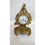 A 19th century French gilt brass rococo revival mantle clock, the 8 day drum movement striking on