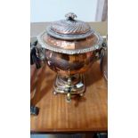 A 19th century copper samovar with brass tap. 15'' high