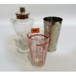 A glass and plated cocktail shaker, flask and liner