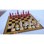 A turned ivory chess set with board