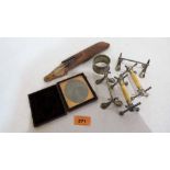 A cased ambrotype, knife rests, spectacles and silver napkin ring