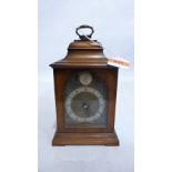 A mahogany bracket style clock of recent manufacture, the brass dial with spandrels and silvered