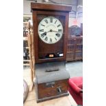 An oak National Recorder clocking in clock. 34½'' high