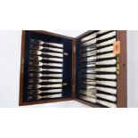 A mahogany canteen of plated and mother-of-pearl hafted cutlery for twelve settings. One fork