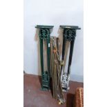 Brass stair rods and a set of four cast iron bannisters