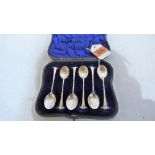 An Edward VII cased set of six silver teaspoons with shell bowls. London 1901