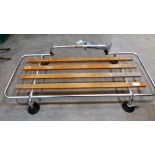 A Desmo aluminium and wood slatted car boot rack. 34'' wide