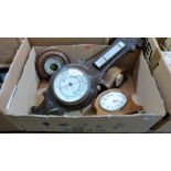 Two aneroid barometers and two mantle clocks