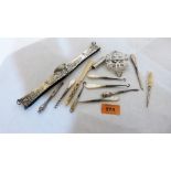 A silver nurse's buckle, a white metal bag clasp, small items of silver etc