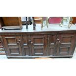 A 17th century joined oak Llanrws dresser, carved and enclosed by three cupboard doors. 84'' wide