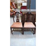 A pair of George III mahogany dining chairs with Hepplewhite design pierced splat backs, leather