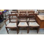 A set of six Regency style mahogany dining chairs, the backs with fret carved lattice rails over