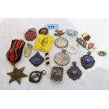 Three silver badges, a WW2 Burma Star and other badges