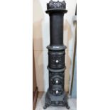 A fine cast iron Jernstoberiet Godthaab stove, in section cylindrical form, the top with pierced