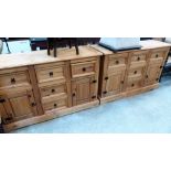 A pair of pine sideboards of recent manufacture fitted with two cupboards and five drawers. 52''