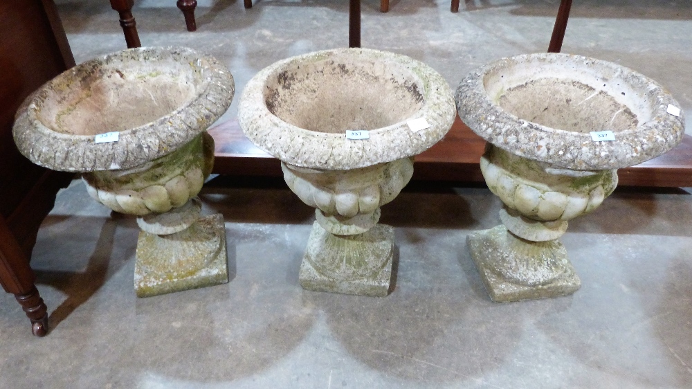 Three campana garden urns. 20' high
