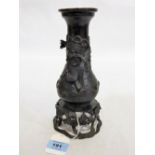 A Japanese bronze baluster vase moulded in relief with birds and foliage. Meiji. 9¼'' high