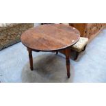 A Victorian pine cricket table with shaped apron on turned legs. 35'' diameter