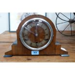 A walnut cased mantle clock