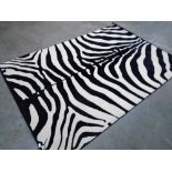 A rug of modernist zebra design. 2m x 2.9m