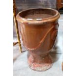 A brown glazed terracotta garden urn. 22' high