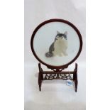 A Chinese carved wood table screen, the banner very finely silk embroidered with a cat. Signed. 19''