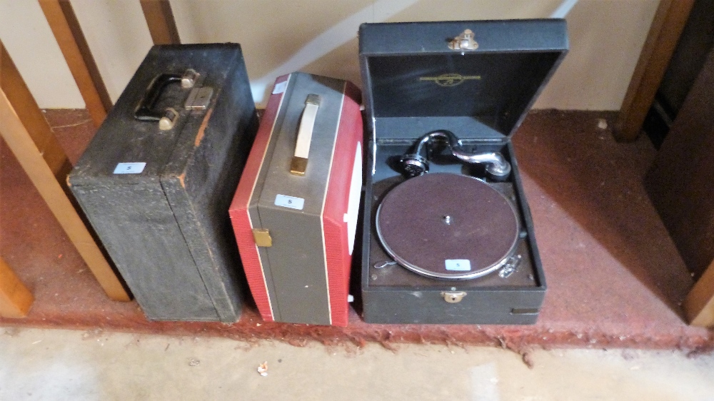 A 1930's picnic gramophone, a 1960's tape recorder and a typewriter