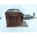 A Victorian walnut and gilt brass magic lantern