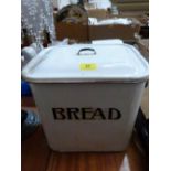 An enamel bread bin and cover. 13'' wide