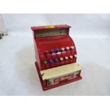 A 1950's tin plate toy cash register, the drawer with St Michael logo. Original box. 6½'' wide