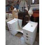 A painted dressing table with oval swing plate and fitted with a pair of lamps. 46'' wide