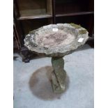 A statuary birdbath 23' high