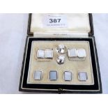 A morocco cased stud set in 9ct white gold. 11.5g gross